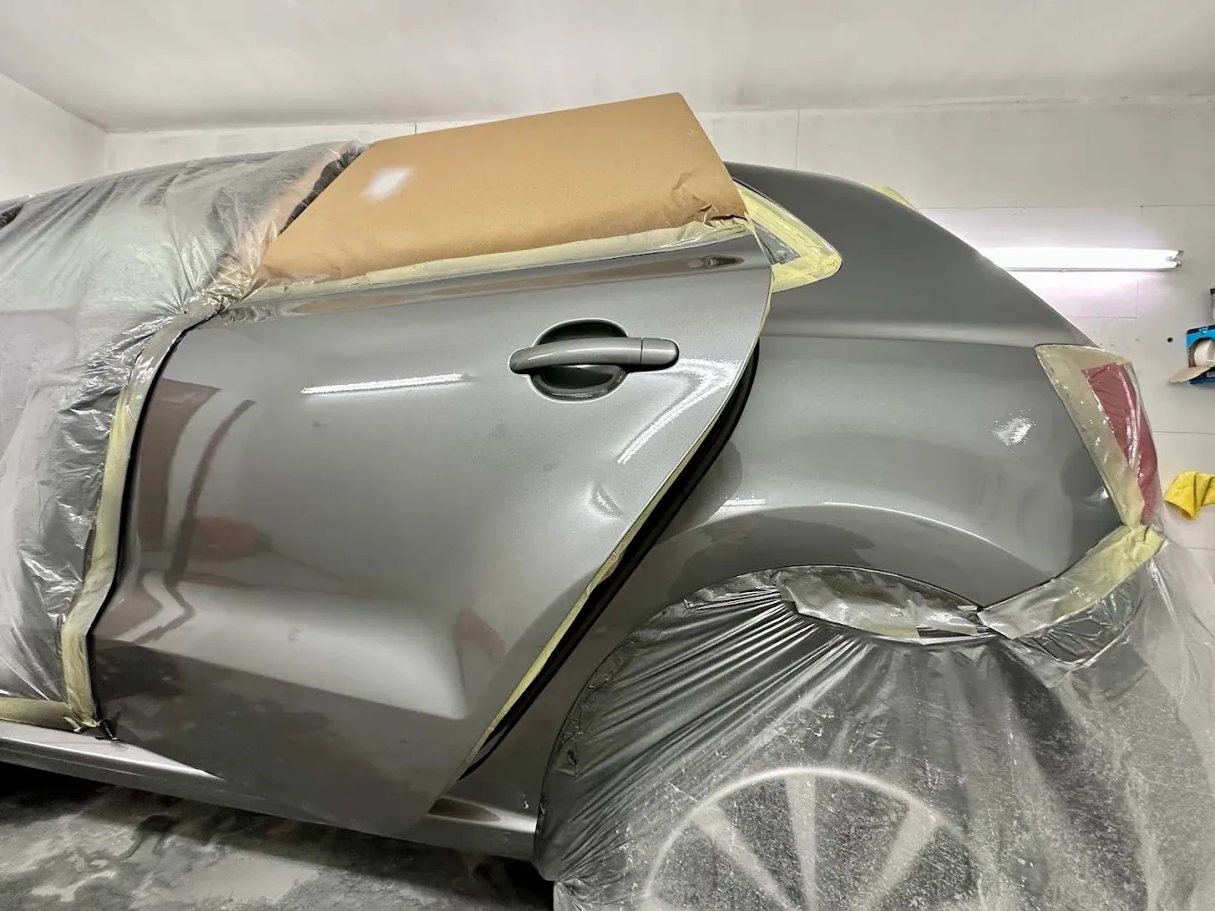 Rear door and quarter panel masked up for paint