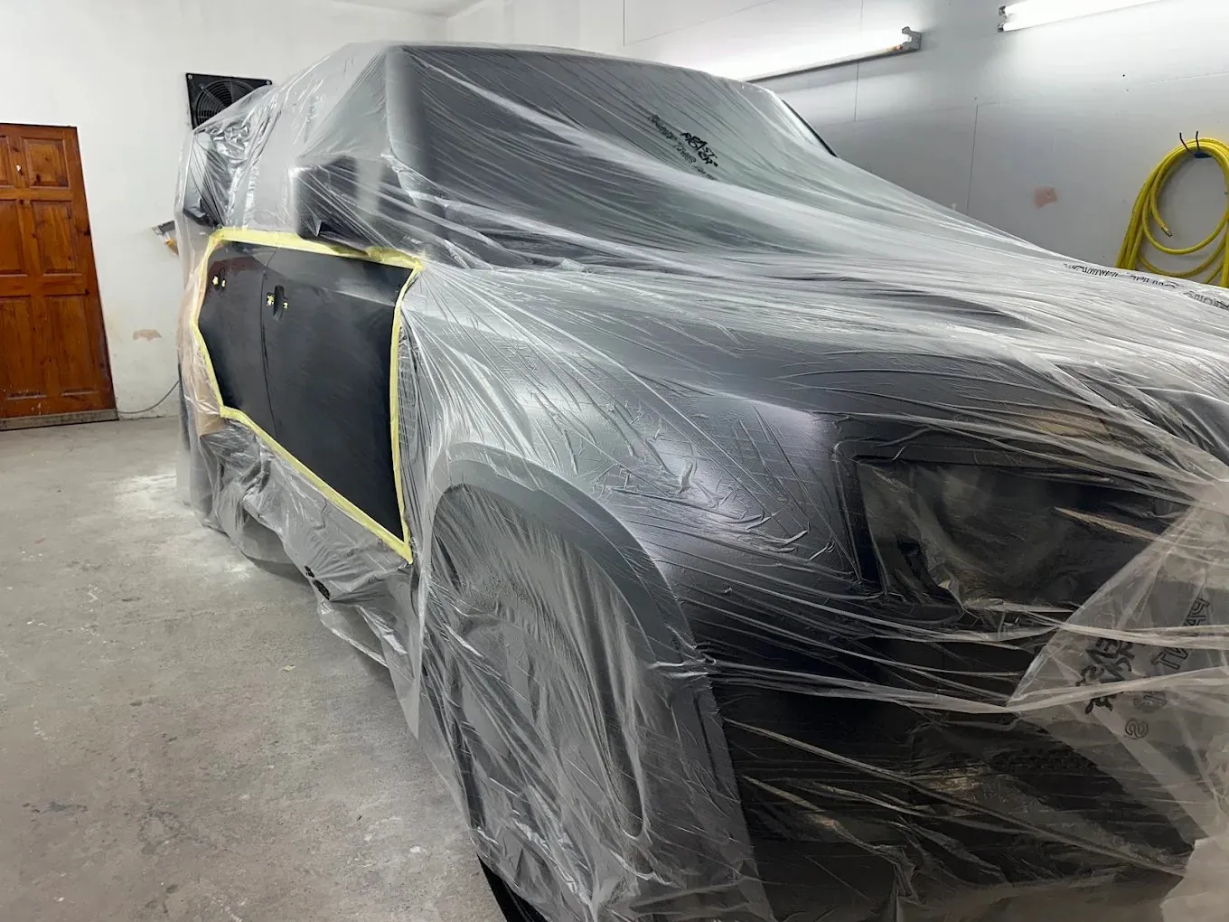 SUV wrapped and masked for a door and wing